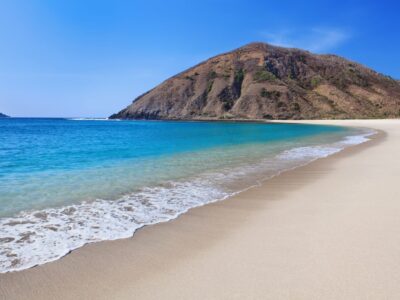 dreamstime_m_72242013-Desert-white-sand-beach-on-ocean-bay-Mawun-in-Kuta-Lombok