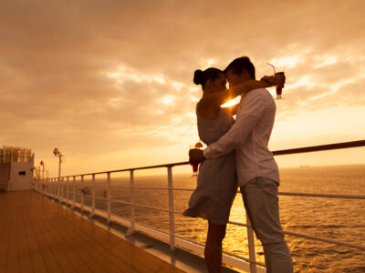 Romantic,Couple,Hugging,With,Eyes,Closed,At,Sunset,On,A
