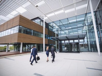 business-people-entering-office-building_107420-74363