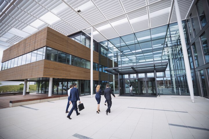 business-people-entering-office-building_107420-74363